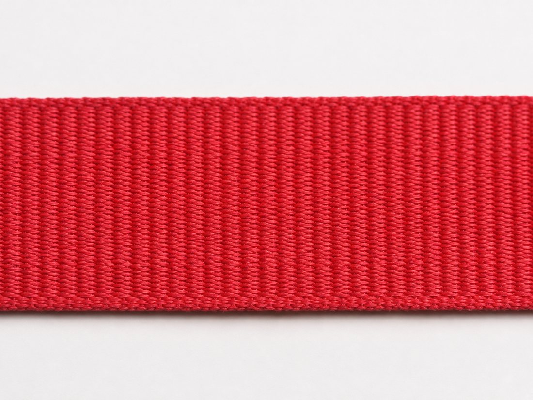 Close-up of red grosgrain ribbon showing the ribs across it